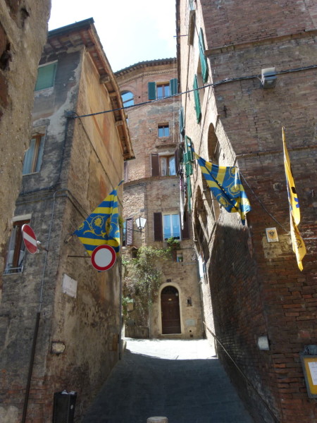 Siena italy tuscany souvenir shopping walking contrada flag streets
