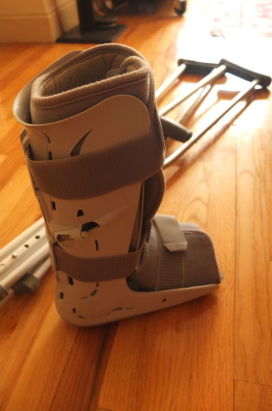 plastic boot and crutches