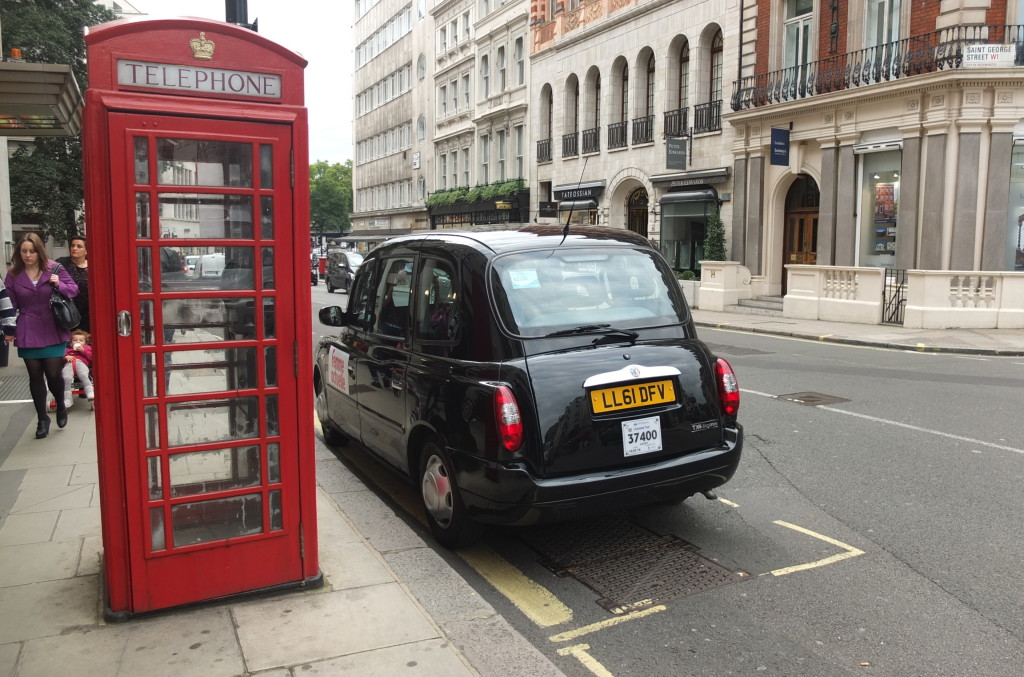 red telephone box and black cab london