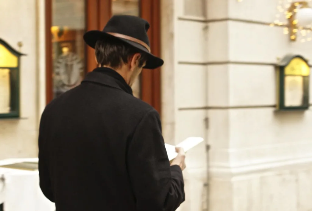 viennese men wearing apline hat distracted walking