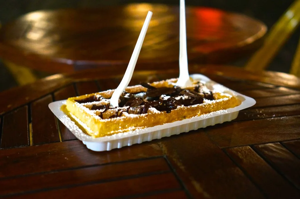 Belgian waffle with shaved chocolate and powdered sugar Brussels Gaufre Liege