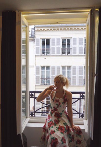 drinking champagne in paris french windows doors